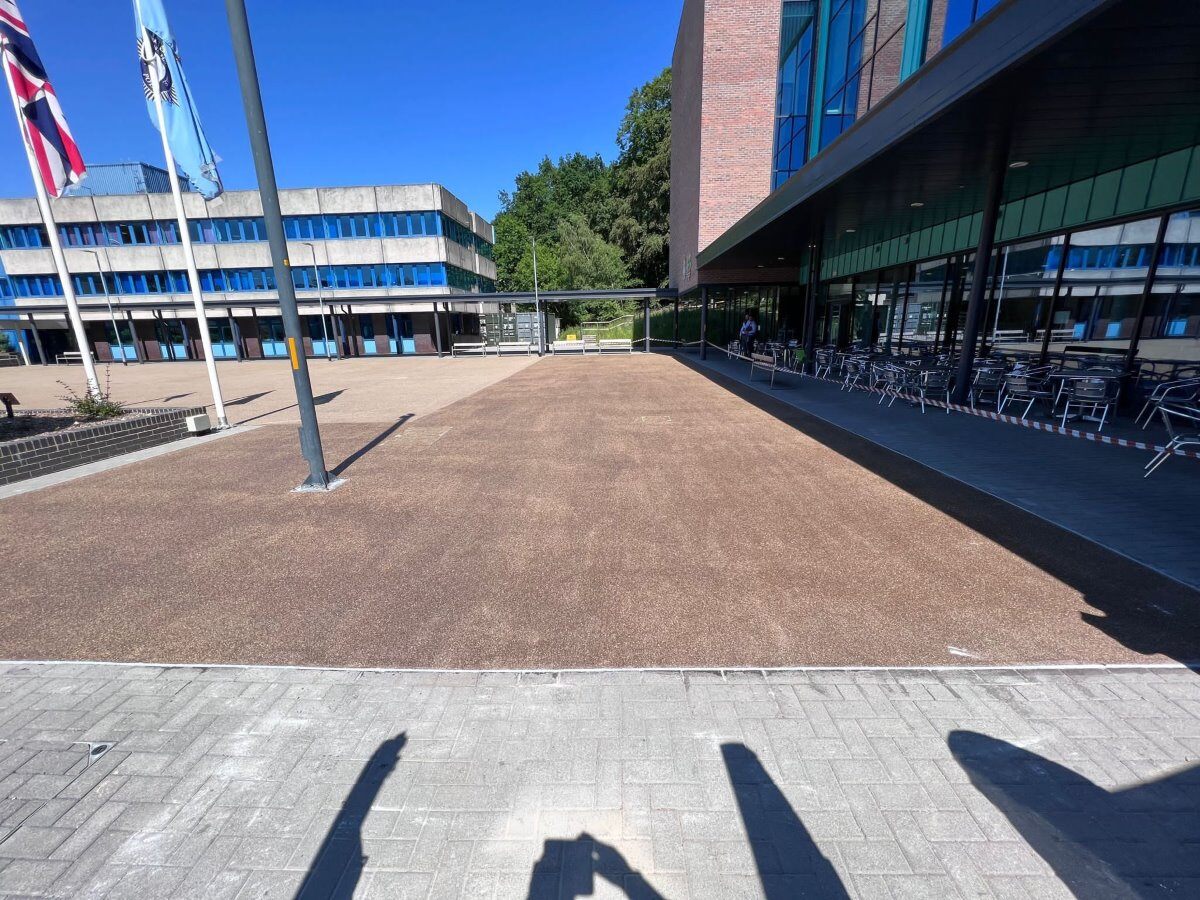 Installation of an outdoor resin flooring in a business park.