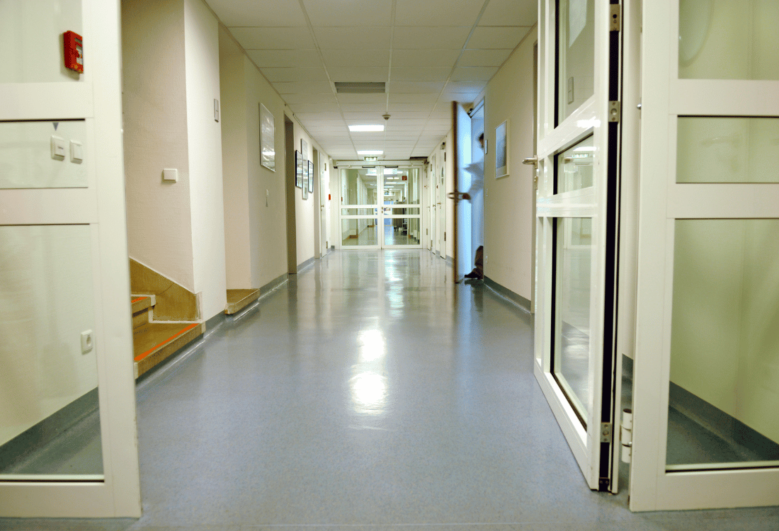 Hospital hallway with slip resistant hygienic resin flooring.