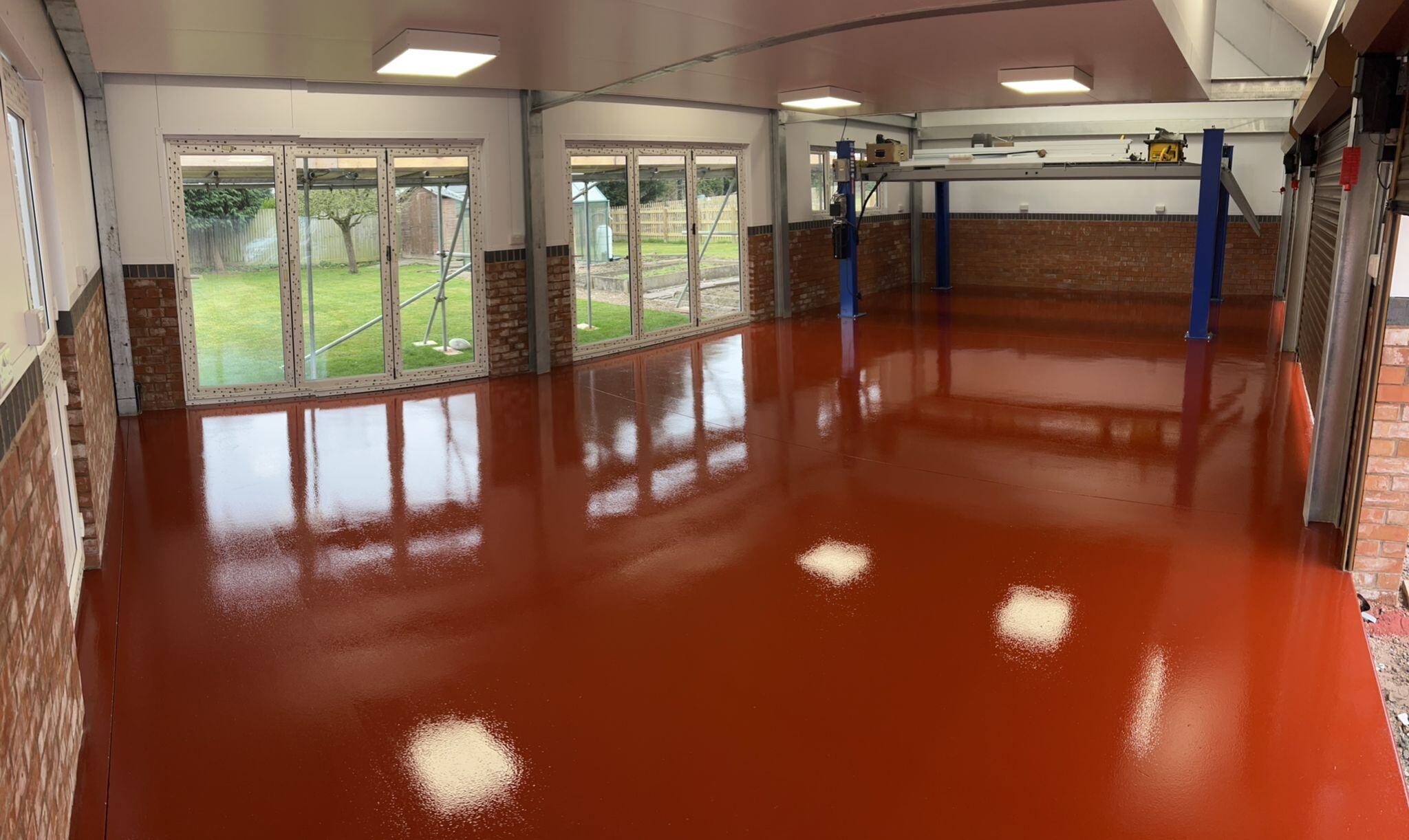 Which resin flooring would you use in car workshops, dealership showrooms and MOT bays?